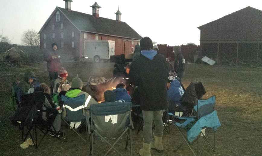 Scouts sitting around a campfire